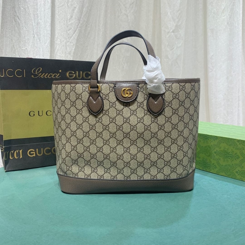 G*u*i shopping bags
